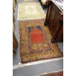 A Persian prayer rug.