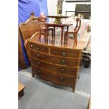 A George III mahogany bowfront chest of two short and three graduated long drawers on splay