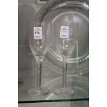 A pair of Lalique wine glasses.