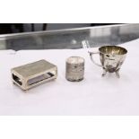 A silver matchbox case, Birmingham 1899, a coin box and a small cup.