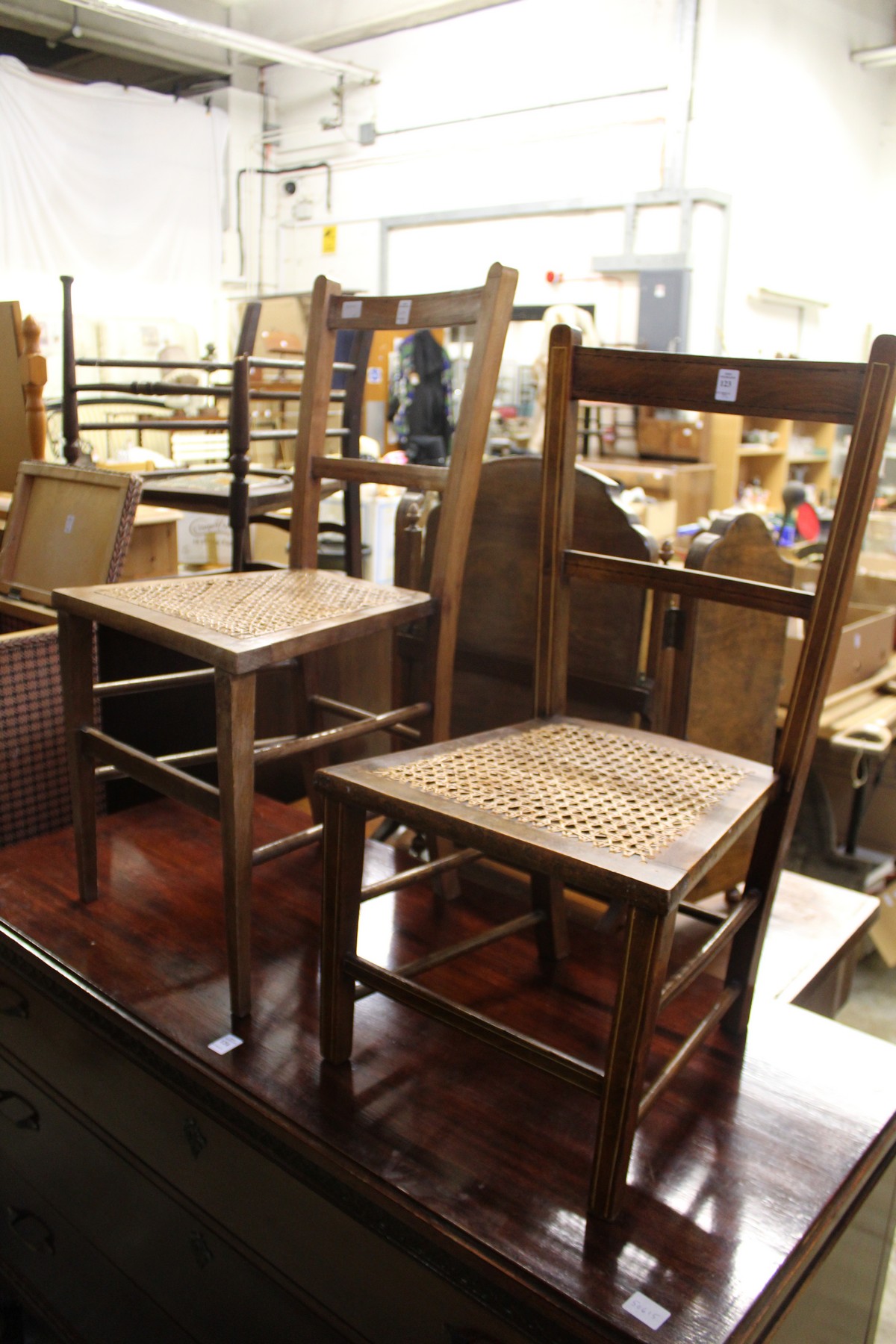 Two cane seated occasional chairs.