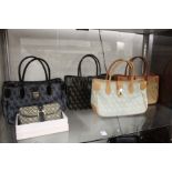 Four Dooney & Bourke handbags and similar purse.