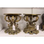 A pair of French ormolu rococo style stands.