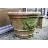 A good large circular terracotta garden planter.