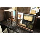 A dressing table mirror and a small oak table.