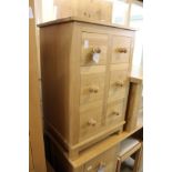A good modern light oak small six drawer chest.