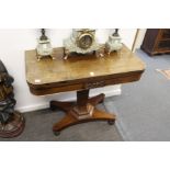 A 19th century rosewood D-shaped foldover card table.