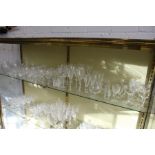 A shelf of cut glass and other drinking glasses.