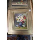 A still life of flowers in a vase, oil on board, in a decorative gilt frame.