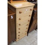 A pine seven drawer chest.
