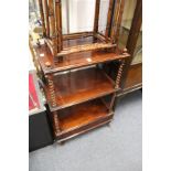A 19th century mahogany three tier what-not with barley twist columns and a single drawer to the