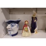 A character mug, a Doulton figurine 'Granny's Shawl' and another 'The Lady Anne Neville'.