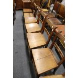 A set of four elm solid seat dining chairs and two similar.