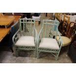 A pair of painted bamboo armchairs.