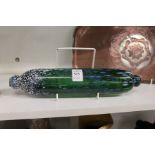 A decorative glass rolling pin.