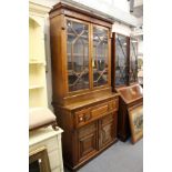 A Victorian walnut secretaire chest with associated bookcase top.