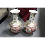 A pair of Chinese famille rose vases.