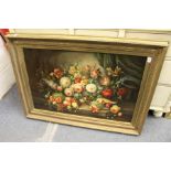 A good large still life of flowers in a basket on a ledge, oil on board, in a decorative gilt