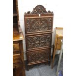A good carved walnut three door hanging cabinet.