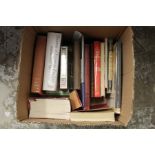 A box of art reference books.