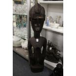 A large carved wood African figure.