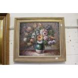 A still life of flowers in a vase, oil on canvas, in a decorative frames.