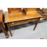 A George III style mahogany two drawer side table on square legs.