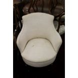 A cream upholstered Edwardian bedroom chair.