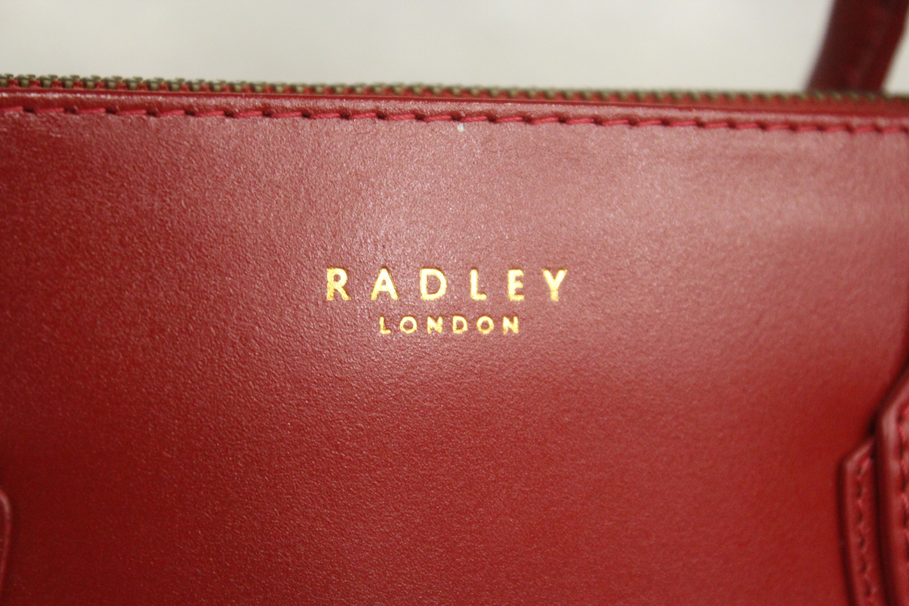 A Radley red leather handbag and three other bags. - Image 2 of 2