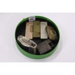 Four Dunhill cigarette lighters, a Ronson Diana table lighter and a decorative vesta case.