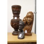Carved wood figures and a similar vase.