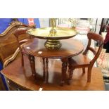 A miniature Victorian style mahogany circular table and a pair of chairs.