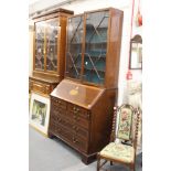 A George III mahogany and satinwood inlaid bureau bookcase (lacking cornice).