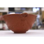 A good small classical style moulded porcelain bowl with terracotta glaze.