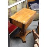 A 19th century mahogany drop flap pedestal work table.