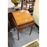 A 19th century oak clerk's desk, the removable upper section with rising top on a base with a single