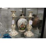 A Dresden vase and cover and a pair of Coalport candlesticks.