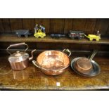 A copper kettle, a small preserve pan and three frying pans.
