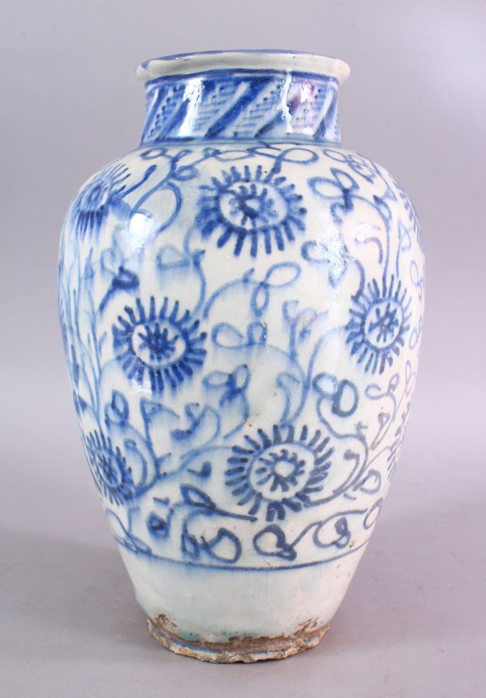 A LARGE 18TH CENTURY PERSIAN SAFAVID BLUE & WHITE GLAZED POTTERY VASE, the vase decorated with