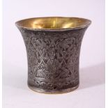 A SMALL BRASS AND ENGRAVED STEEL BEAKER SHAPED VESSEL, the exterior engraved with figures, 7.5cm