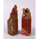 A PAIR OF 19TH / 20TH CENTURY CHINESE CARVED SOAPSTONE SEALS, one of monkeys upon horse, the other