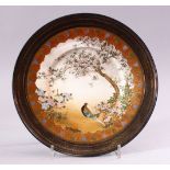 A JAPANESE MEIJI PERIOD SATSUMA SILVER MOUNTED PLATE, the plate encapsulated with a solid silver