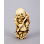 A JAPANESE MEIJI PERIOD CARVED IVORY OKIMONO OF HOTEI, the small carved figure depicting hotei