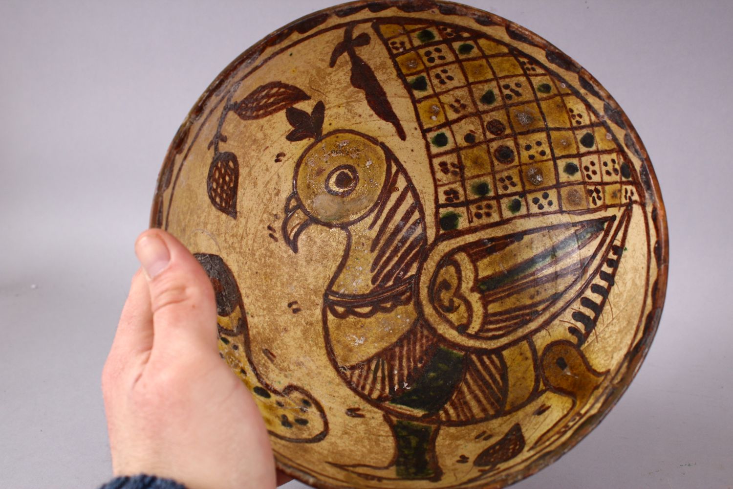 AN EARLY ISLAMIC POTTERY BOWL painted to the interior with a bird, 20cm diameter. - Image 2 of 3