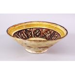 A 12TH CENTURY ISLAMIC / PERSIAN POTTERY BOWL, with brown decorated panels, upon biscuit colour