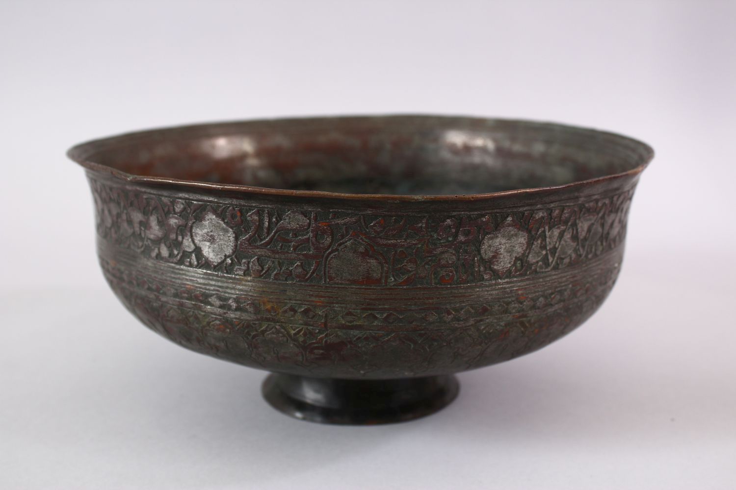 A 19TH CENTURY IRAN PERSIAN SAFAVID CALLIGRAPHIC BRONZE BOWL, with bands of calligraphy and floral