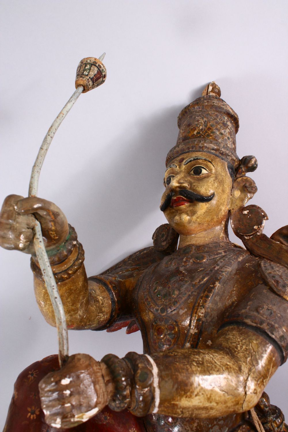 A 19TH CENTURY INDIAN / BURMESE CARVED WOOD FIGURE OF A WINGED GOD, stood holding an implement, with - Image 2 of 5