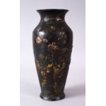 A SMALL JAPANESE POSSIBLY MEIJI PERIOD MIXED METAL VASE, depicting a crane amongst native flora,