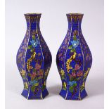 A 19TH / 20TH CENTURY CHINESE CLOISONNE VASES, with wirework depicting floral spray upon a blue