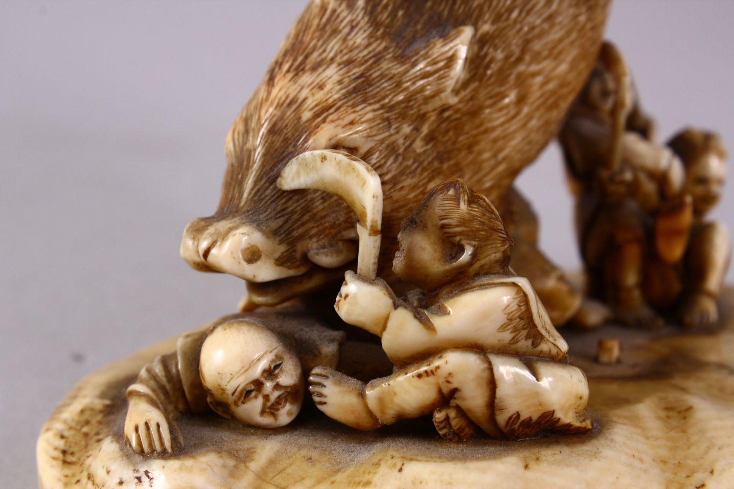 A JAPANESE MEIJI PERIOD CARVED IVORY OKIMONO GROUP- depicting a boar being attacked by numerous - Image 10 of 12